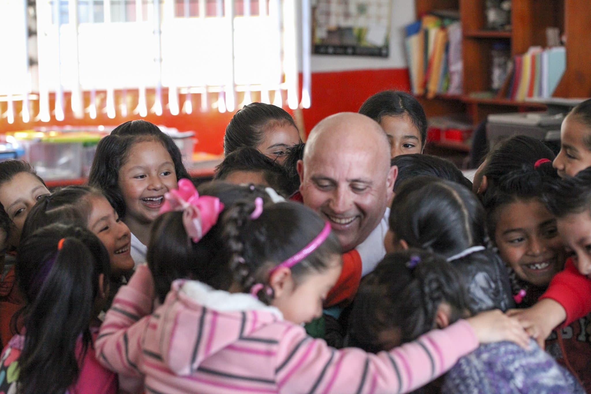 Volunteers spending time with children at a school in Serdan, Mexico